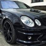 Προφυλακτήρας εμπρός tuning για Mercedes W211 E-Class (2002-2009) - AMG με μαύρη μάσκα και προβολάκια